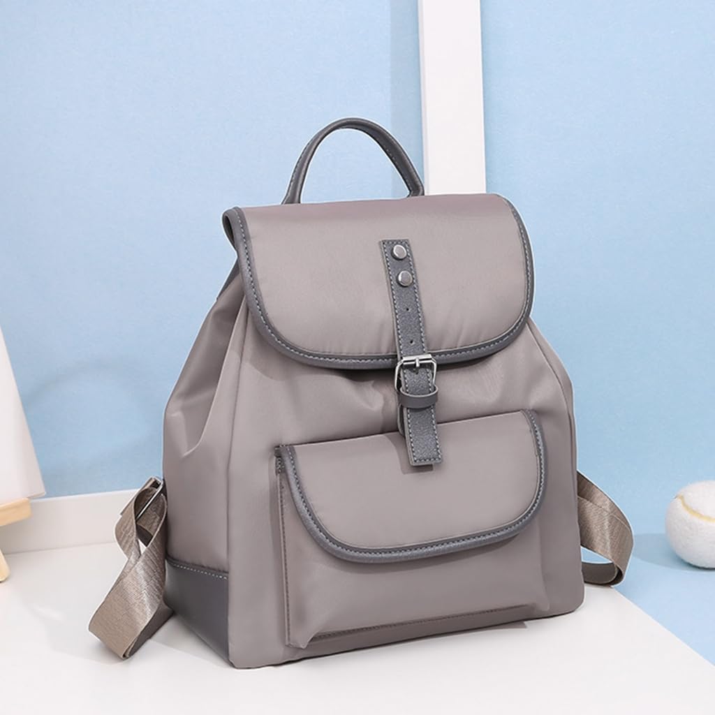 grey compact women's faux leather backpack, front view, with flap closure and front pocket